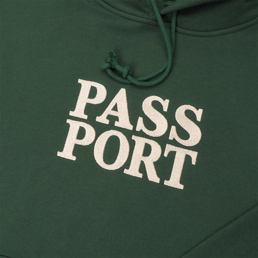 Pass~Port | Official Stacked Hoodie. Forest Green