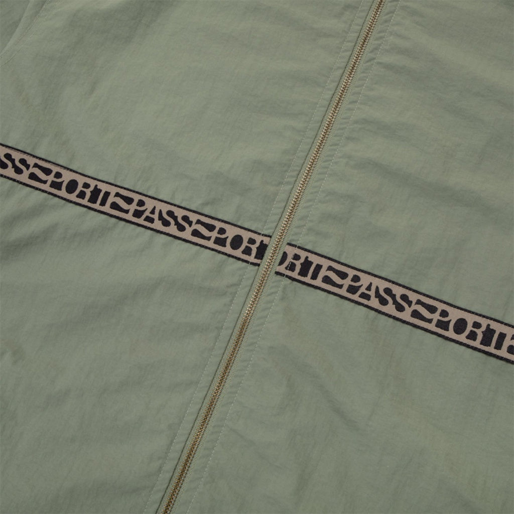 Pass~Port | Rough Neg RPET Track Jacket. Sage