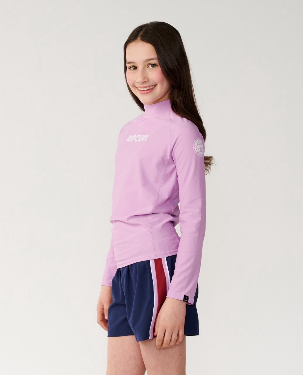 Rip Curl | Girls Classic Surf 50+ UPF Long Sleeve Rashguard. Lilac