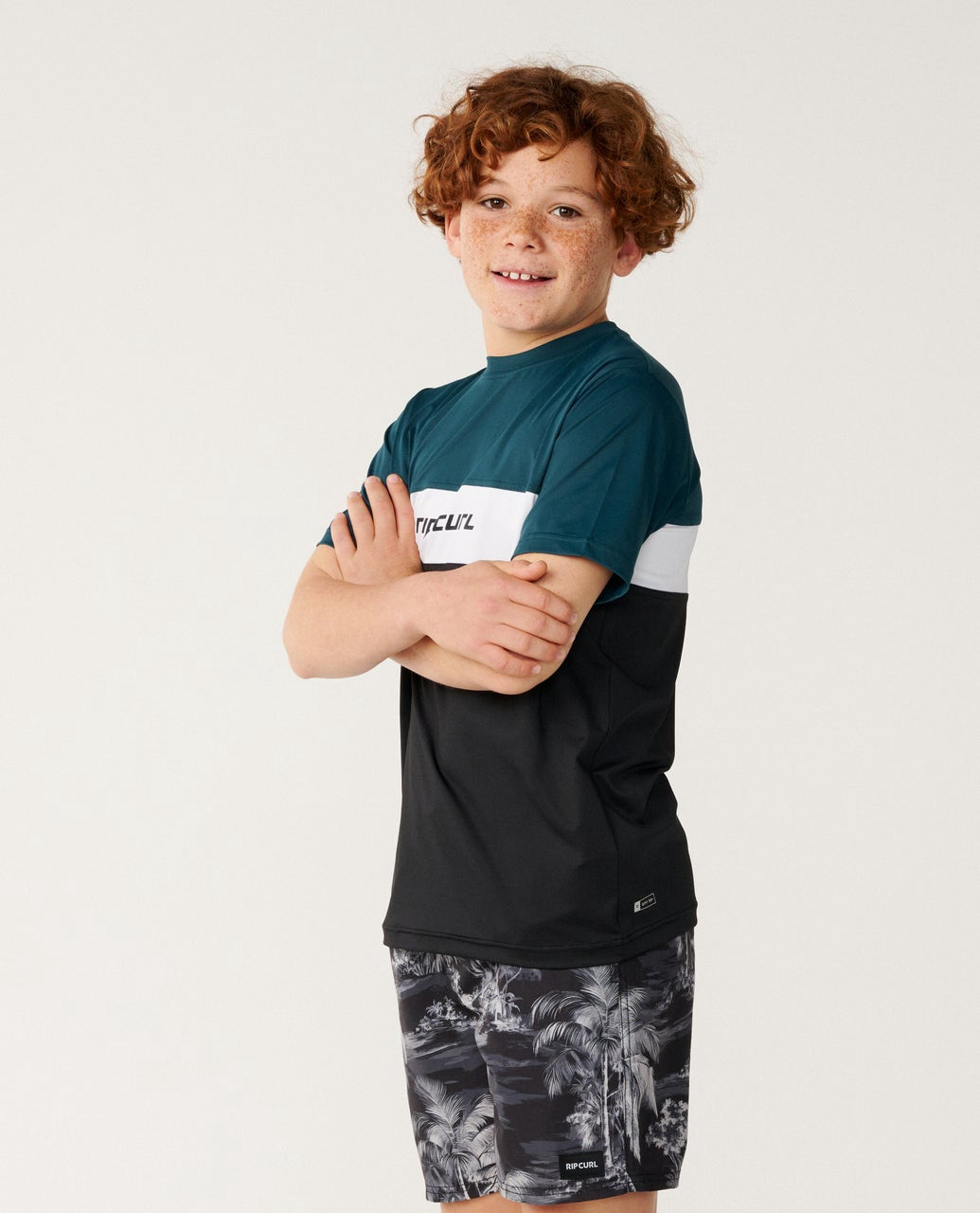 Rip Curl | Boys Undertow 50+ UPF Short Sleeve Rashguard. Blue Green